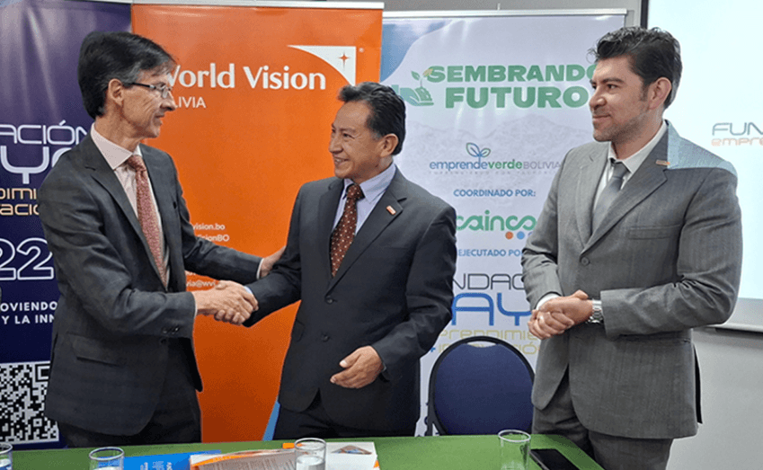 World Vision Bolivia and Fundación Maya representatives shaking hands